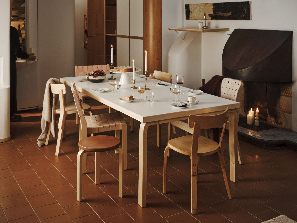 Artek 69 Chair | Lifestyle with Terracotta Floor and roaring fire