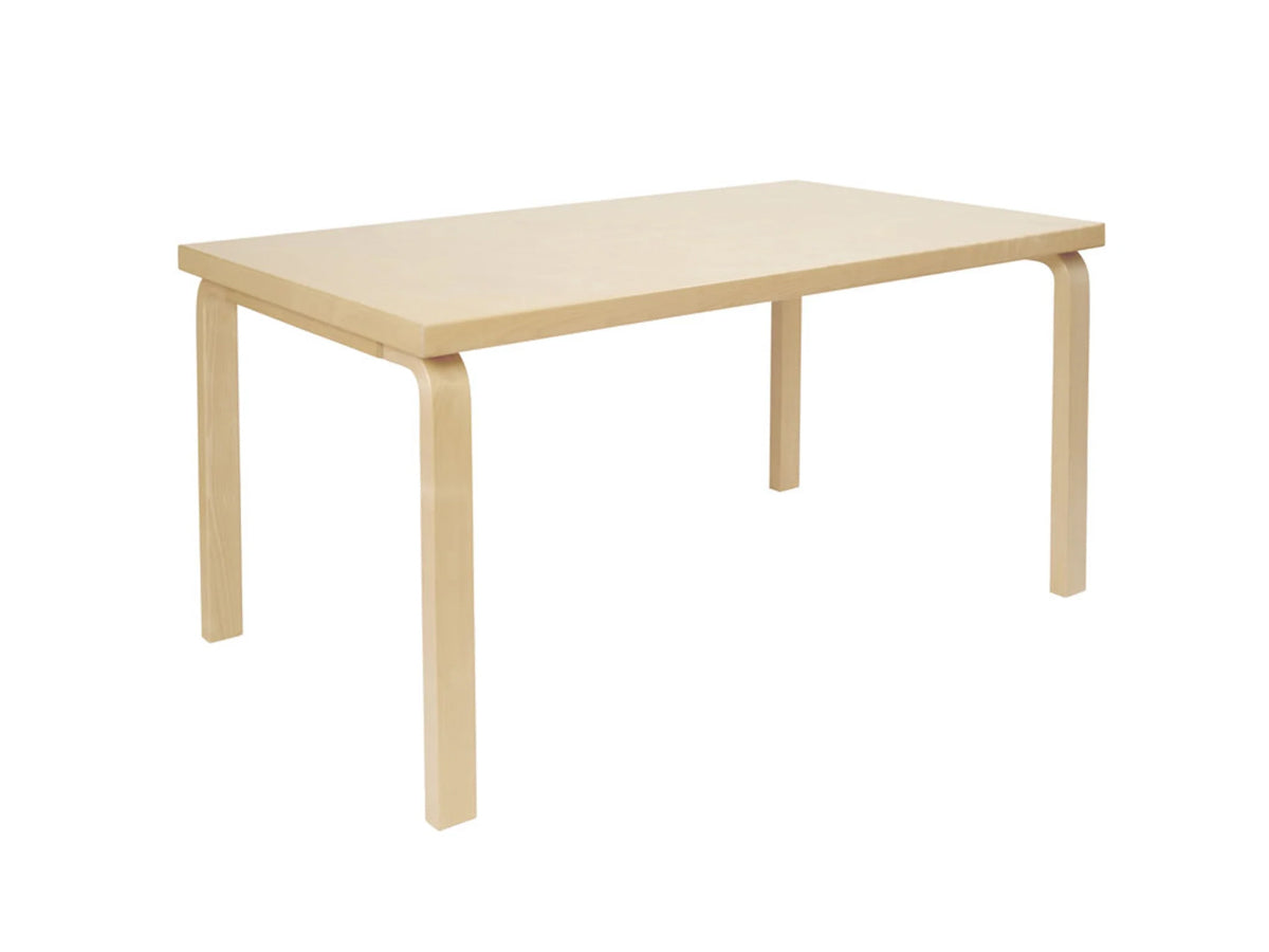 A rectangular Artek 82A dining table with L-shaped legs in natural lacquered birch wood.
