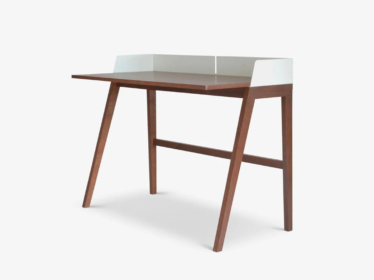 Walnut desk with a white steel partition on a white background. Case Brockwell Desk in Walnut