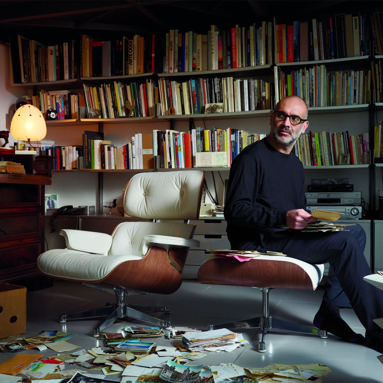 eames lounge chair with man sat on ottoman