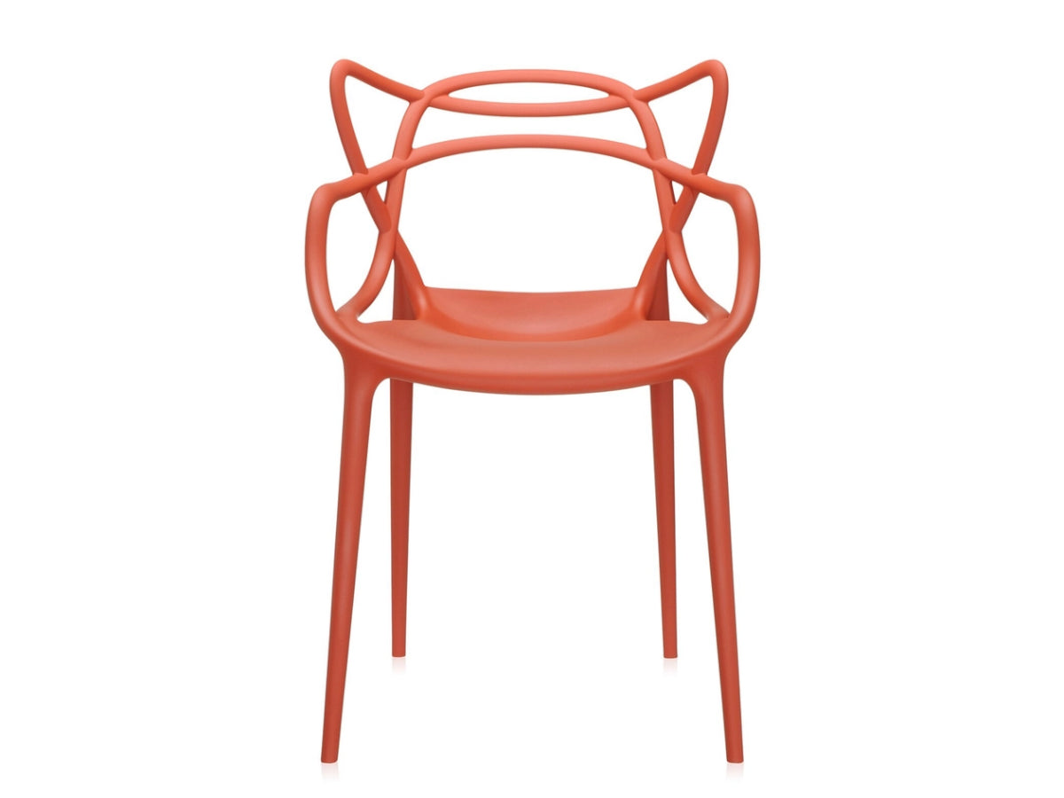Kartell Masters Rusty Orange chair with a modern design on a white background