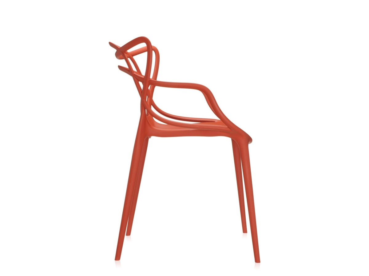 Kartell Masters Rusty Orange chair with a modern design on a white background, side profile