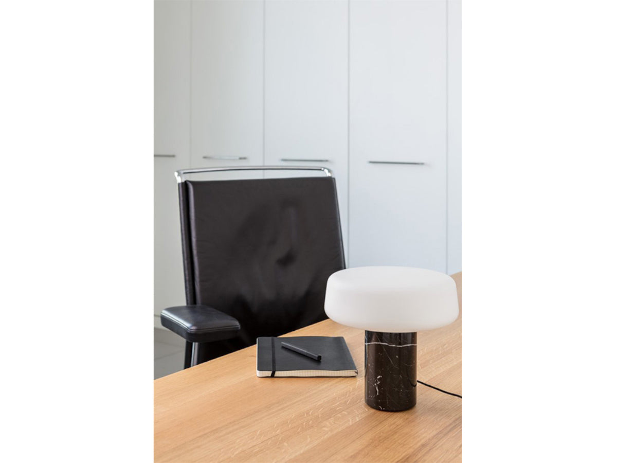 Terence Woodgate Solid Table Light Small - Marquina Marble on a desk with Black office chair