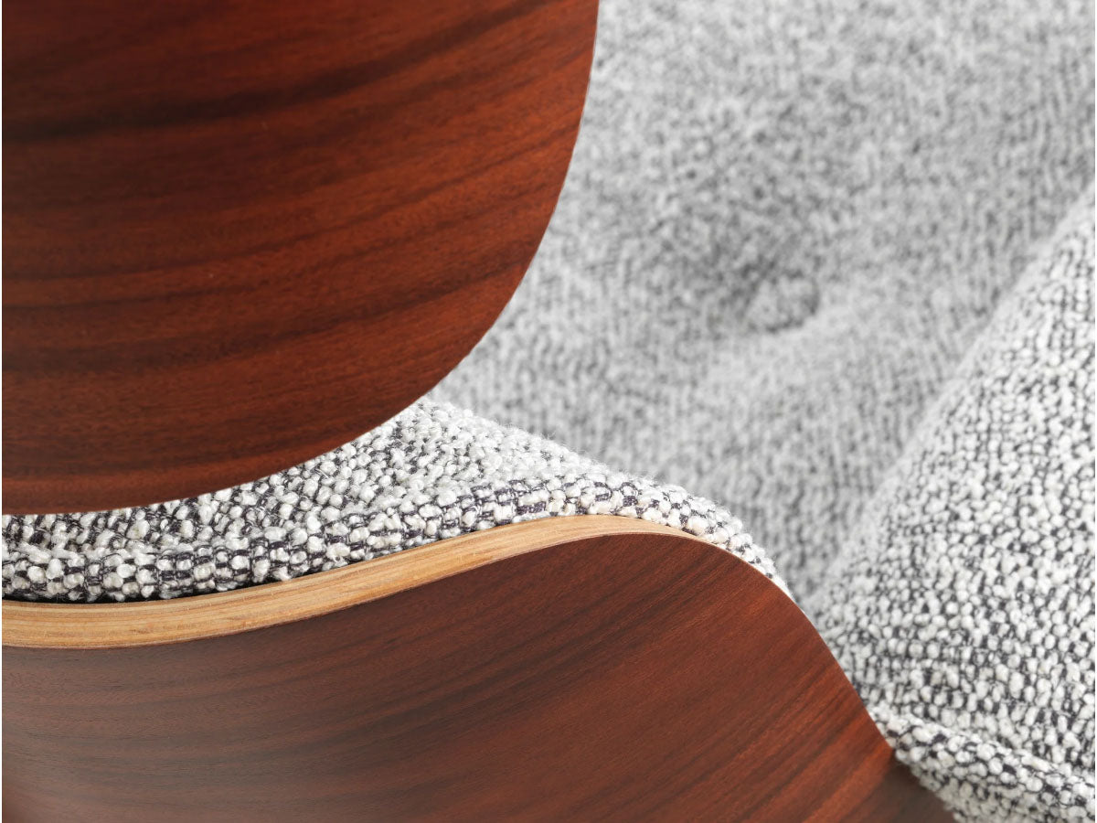 close up of detail of fabric and wood on eames xl lounge chair