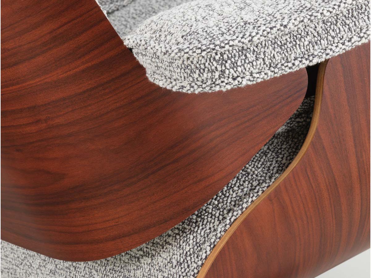 close up of detail of fabric and wood on eames xl lounge chair