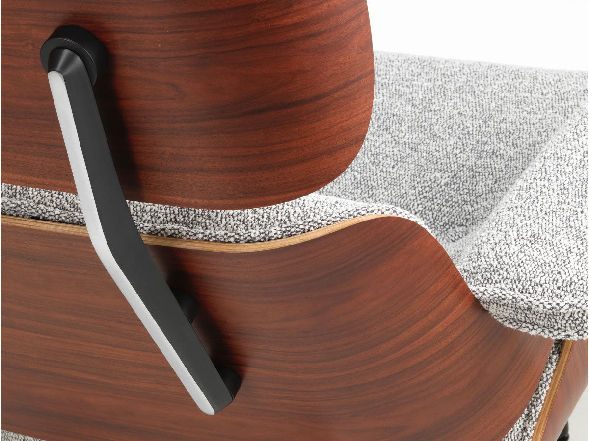 close up of detail of fabric and wood on eames xl lounge chair