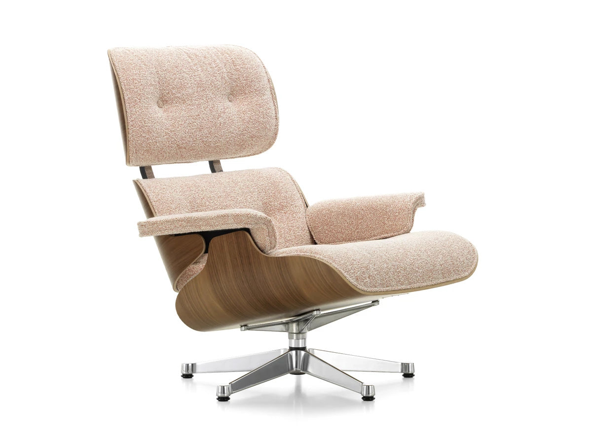A Vitra Eames Lounge Chair with a fabric cushion and a wooden frame
